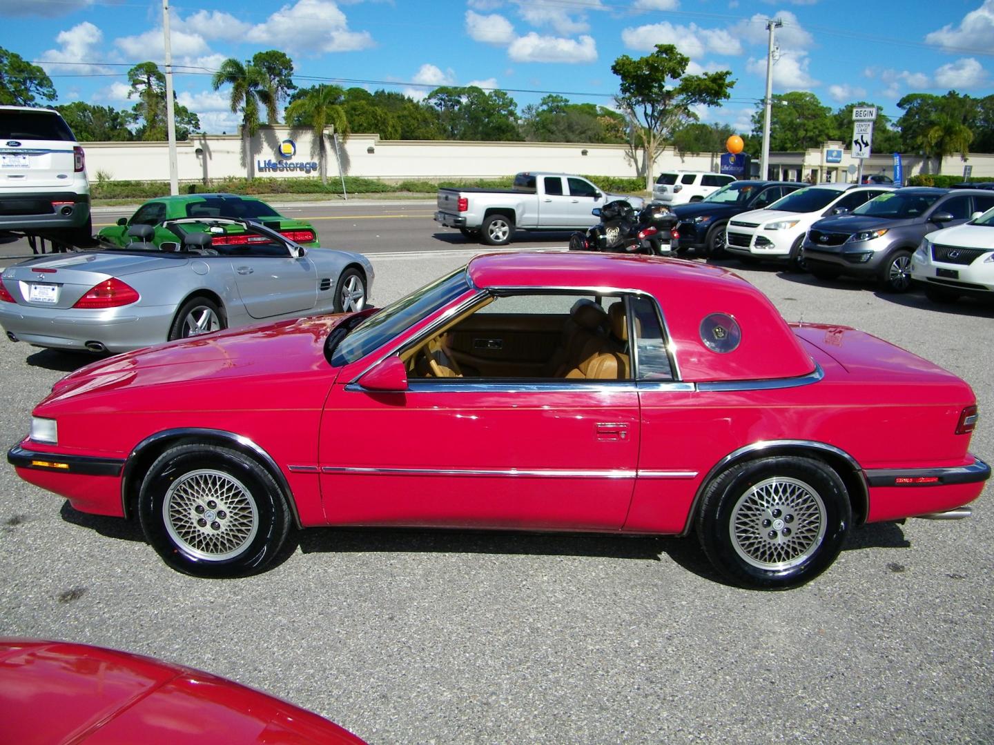 1991 Red /Beige Chrysler TC By Maserati Convertible (ZC2FS1207MB) with an 3.0L V6 SOHC 12V engine, 4-Speed Automatic Overdrive transmission, located at 4000 Bee Ridge Road, Sarasota, FL, 34233, (941) 926-0300, 27.298664, -82.489151 - Photo#2